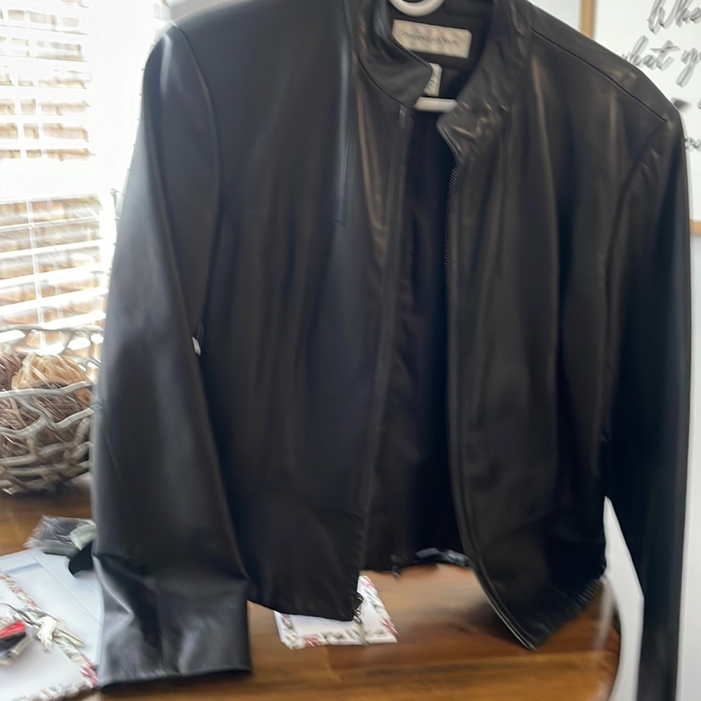 Black leather jacket the measurements are 23”inches arms length 21”width15”